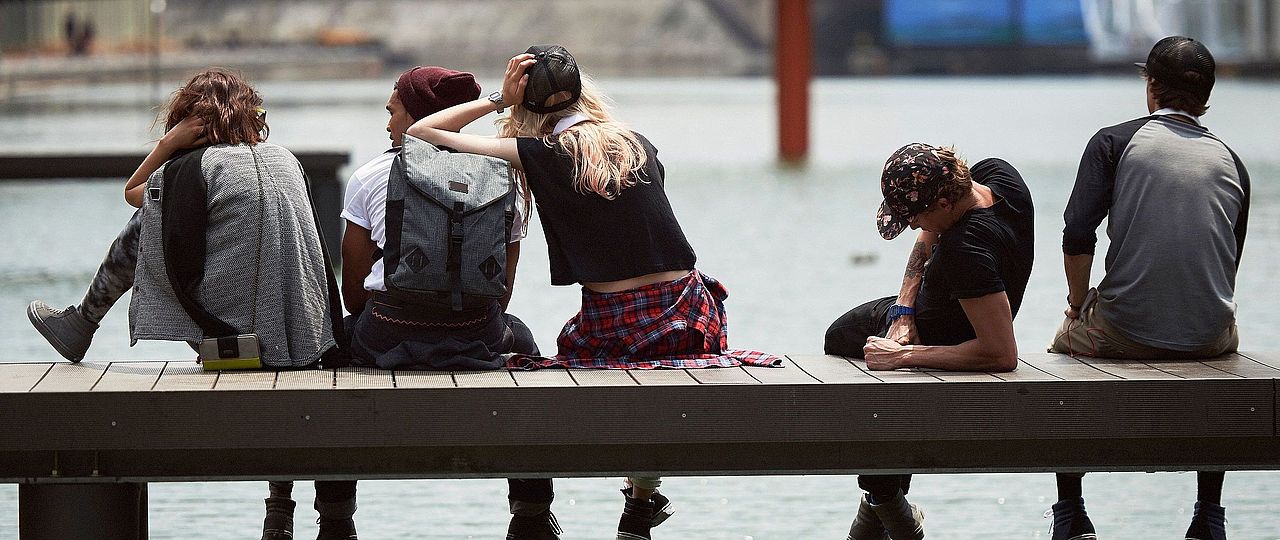 youths hanging on a pier